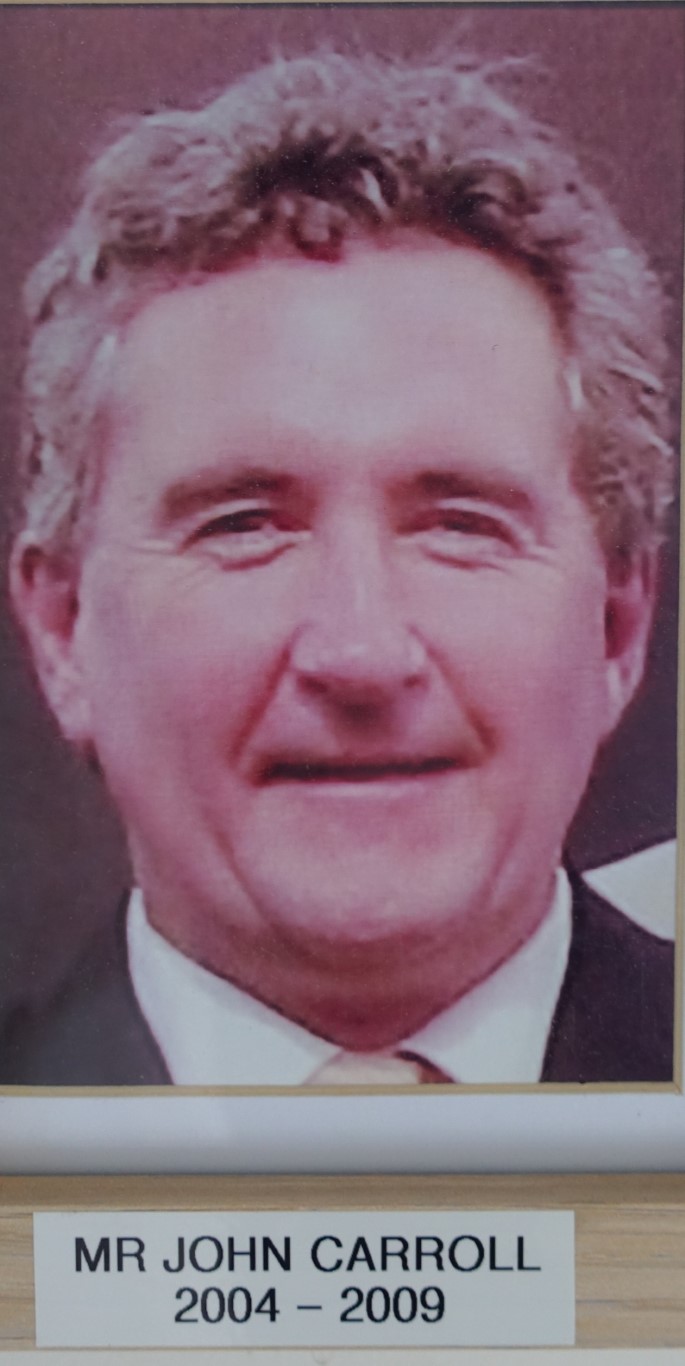 Past Principal 2004 to 2009, John Carroll, smiling
