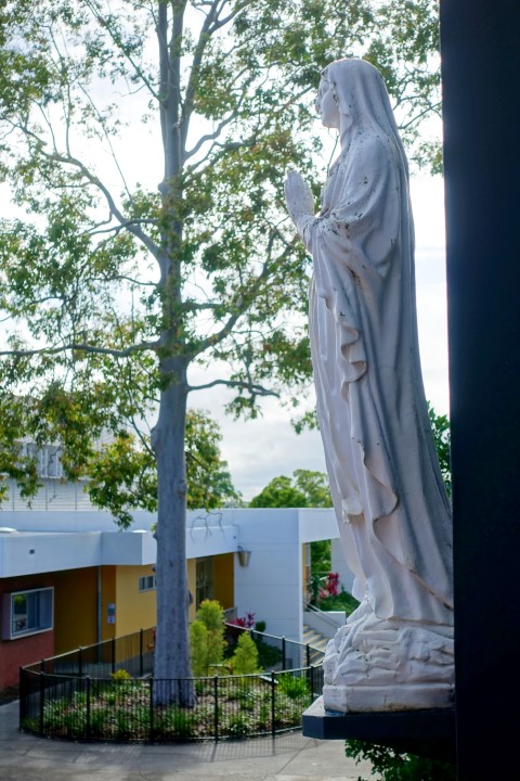Image of St Catherine statue with the Nano Nagle Centre in the background