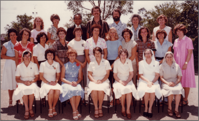 Image of Sr Denise Ryan surrounded by staff - 1981